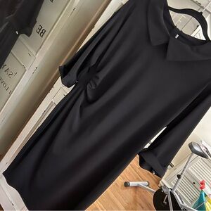 Tailored slim fit black dress, 3/4 sleeve w/turned back cuffs.  XXL Runs Small